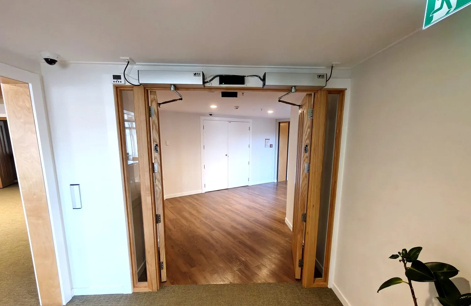 Modern NZ home with automatic garage door installed by Navigate Doors and Gates